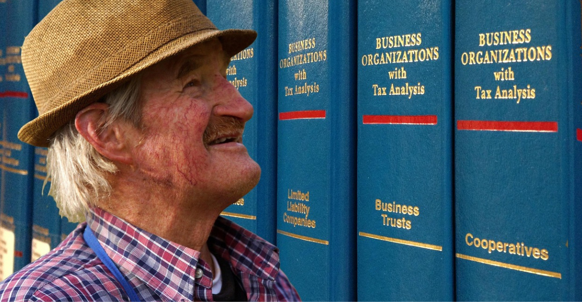 Man looking at company law books